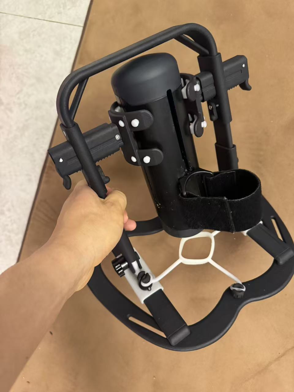 Prototype VR accessory mount with adjustable frame and central mounting area
